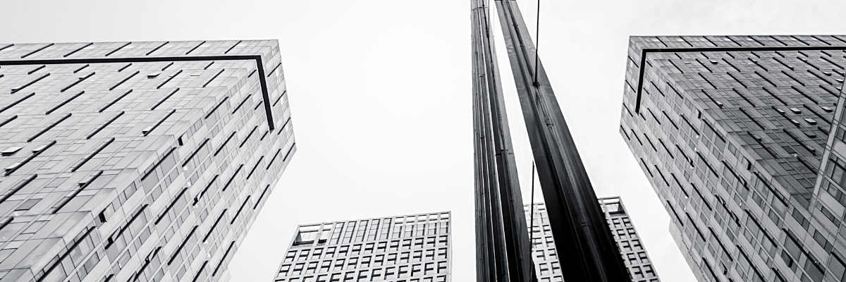 a black and white photo of four office buildings