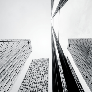 a black and white photo of 3 corporate office buildings