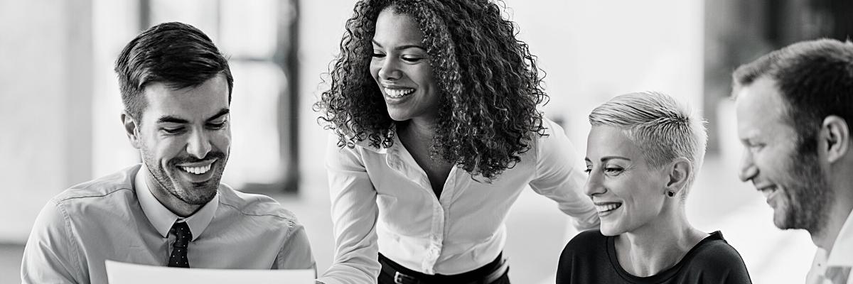 a black and white photo of four financial consultants