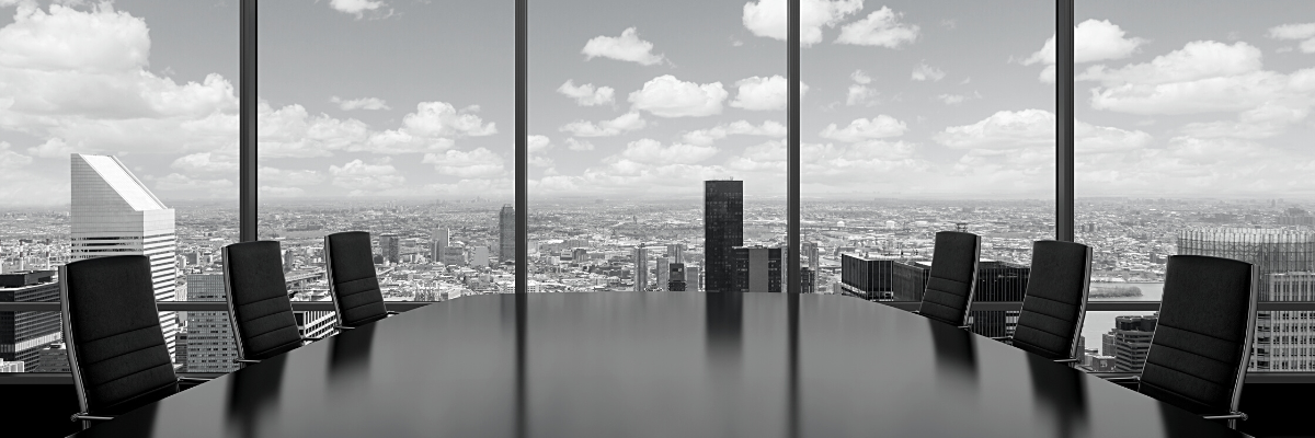 a black and white photo of a senior executive board room