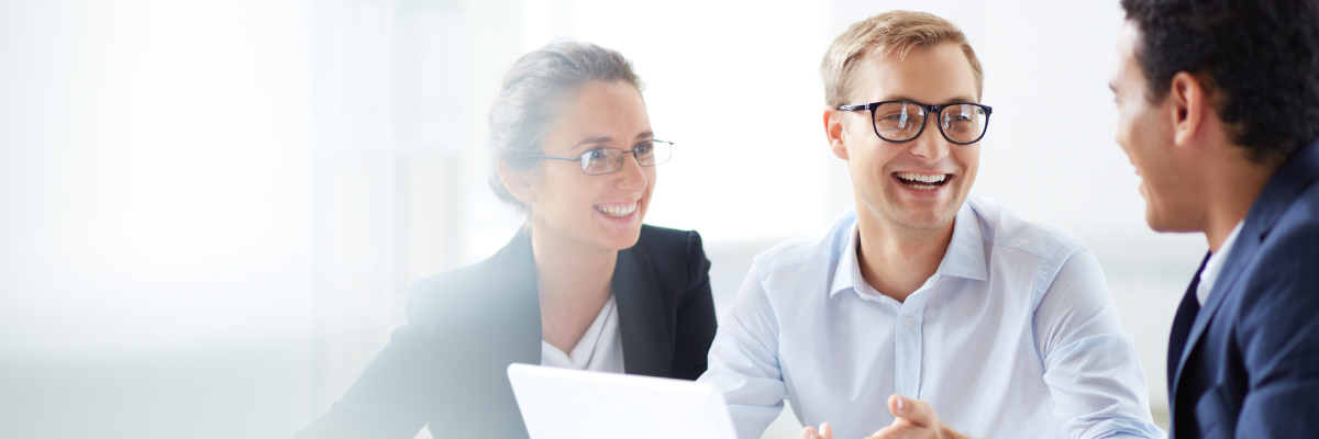 a group of financial people sitting around a table