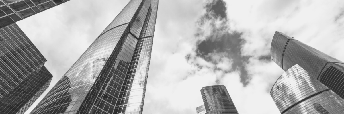 a black and white photo of a range of finance buildings