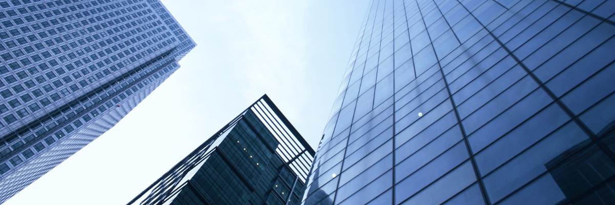 a blue landscape picture image of three buildings