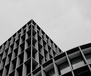 a black and white photo of a corporate building